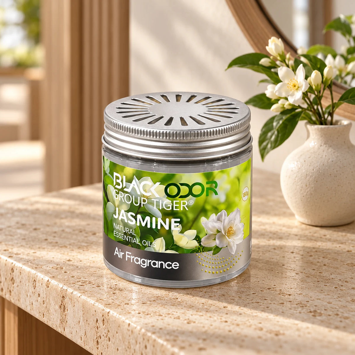 BLACK ODOR Classic Gel Jasmine 180g air freshener on a home console beside white flowers